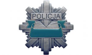 odznaka z napisem Policja