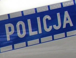 napis Policja na drzwiach radiowozu